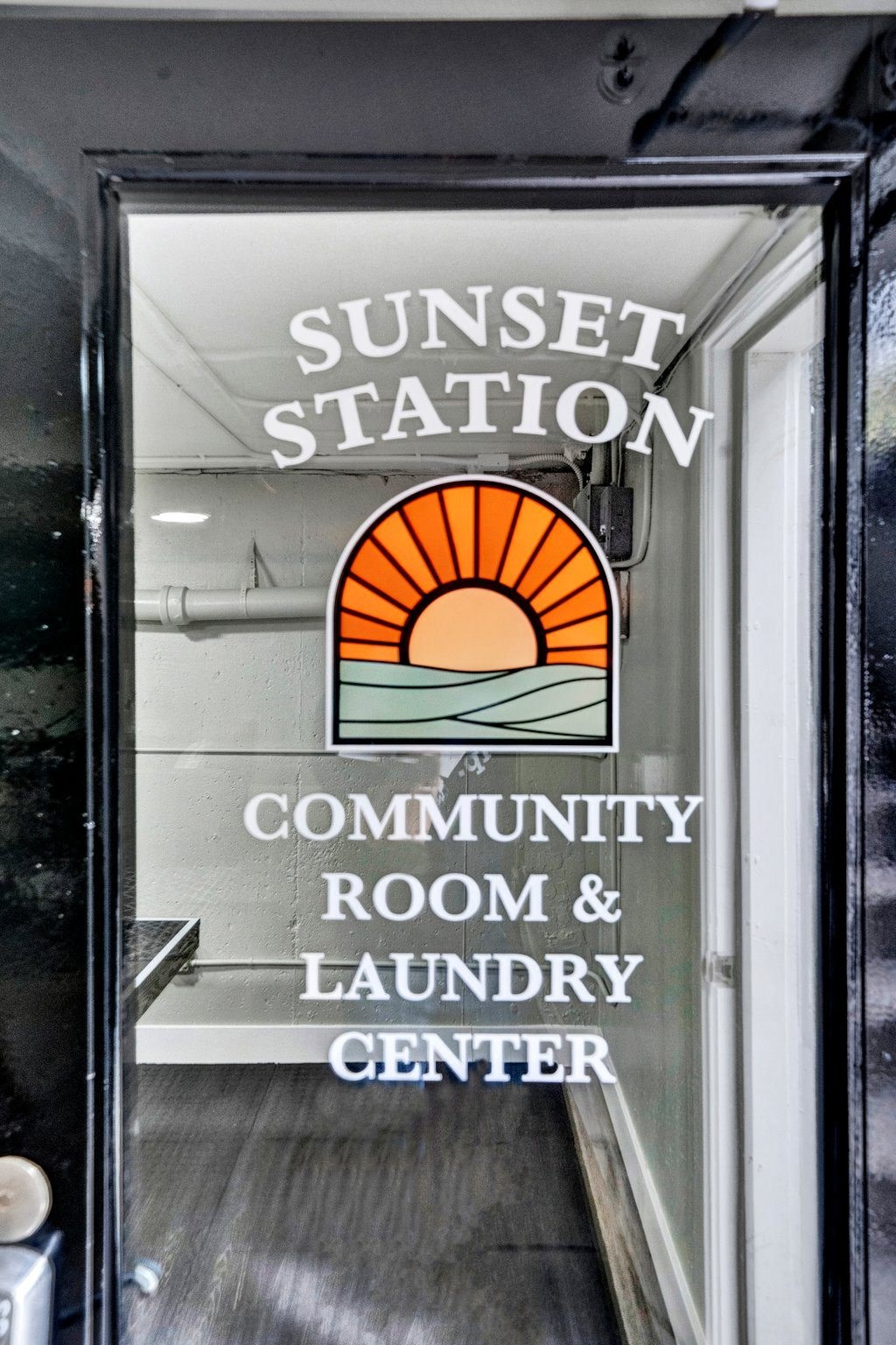 a sign on the door of the sunset station community room and laundry center Sunset Station Apartments Portland Oregon 