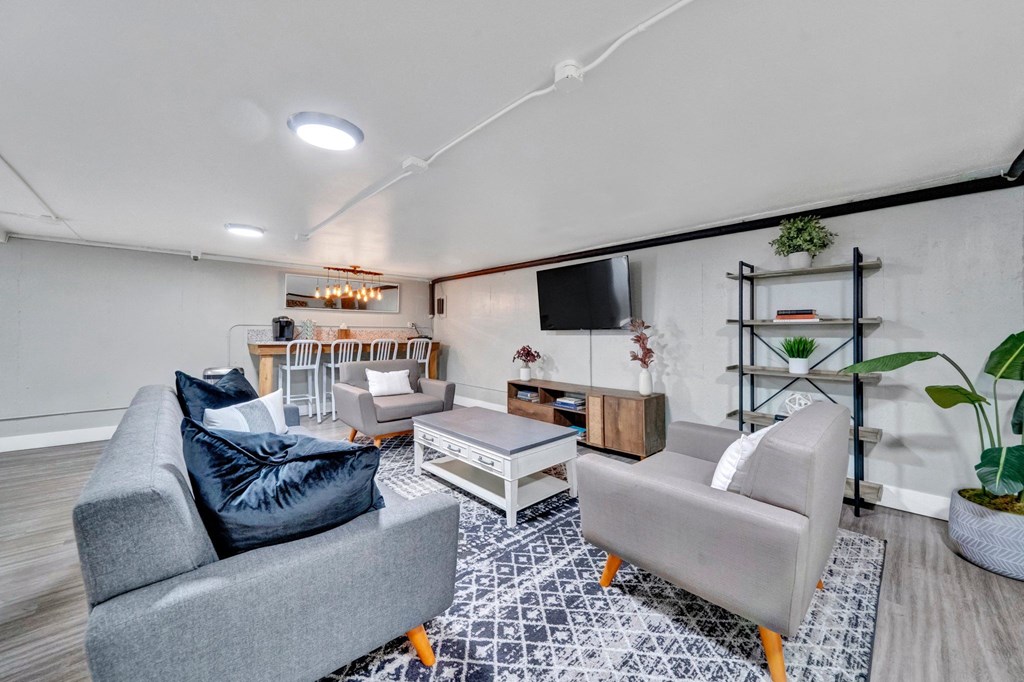 a living room with couches and a coffee table Sunset Station Apartments Portland Oregon 