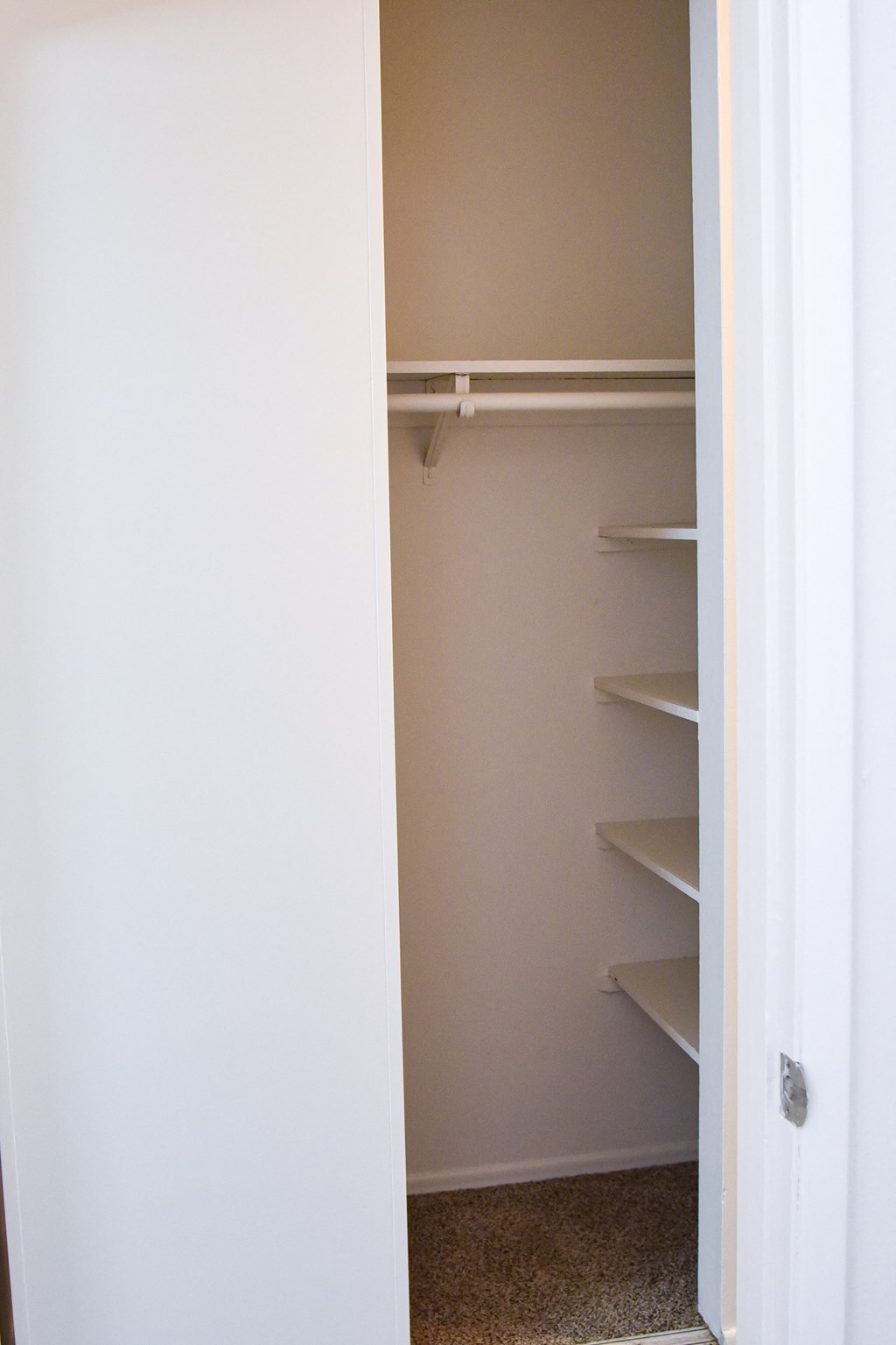 a walk in closet in a bedroom