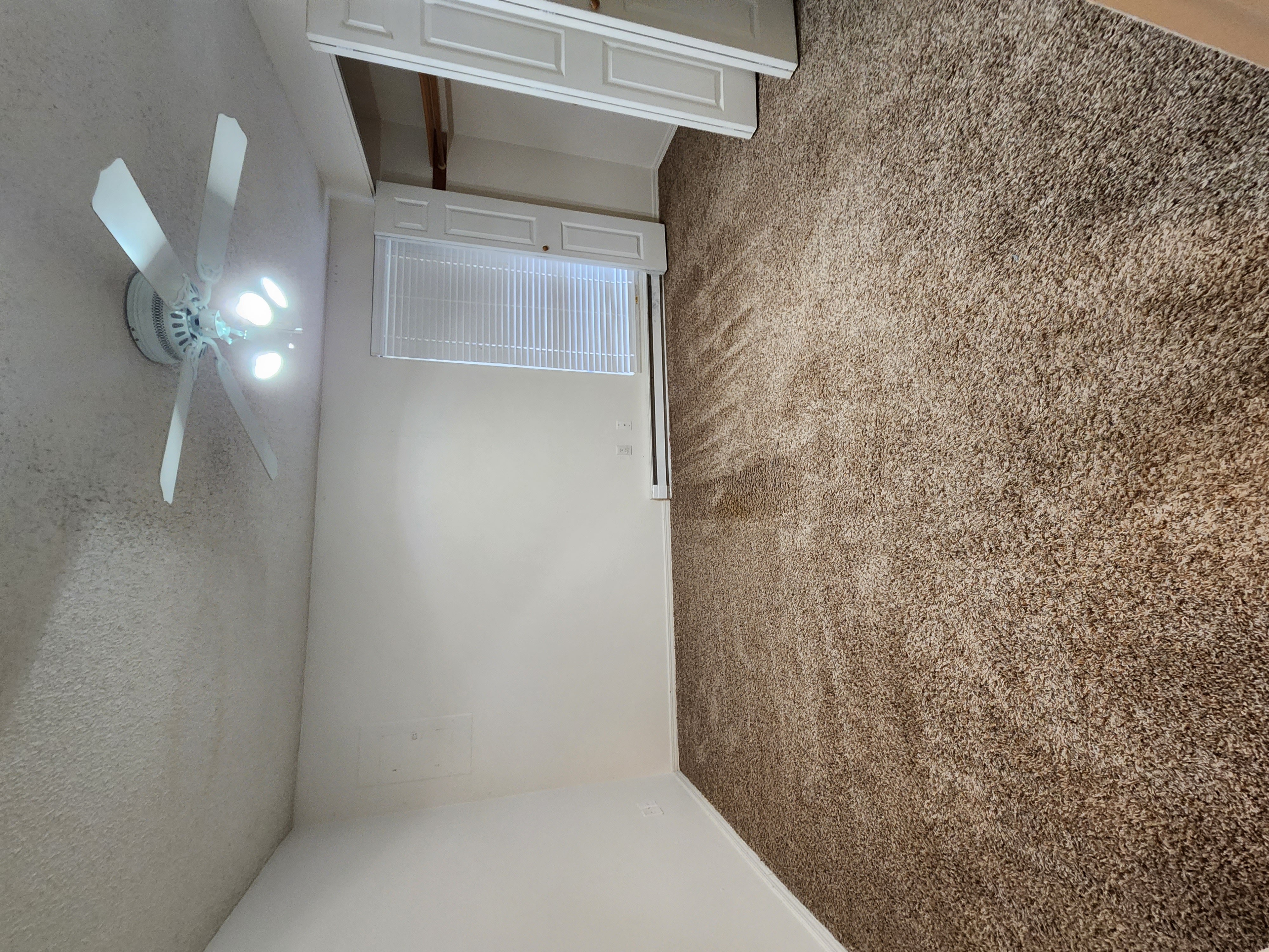 a room with a ceiling fan in it