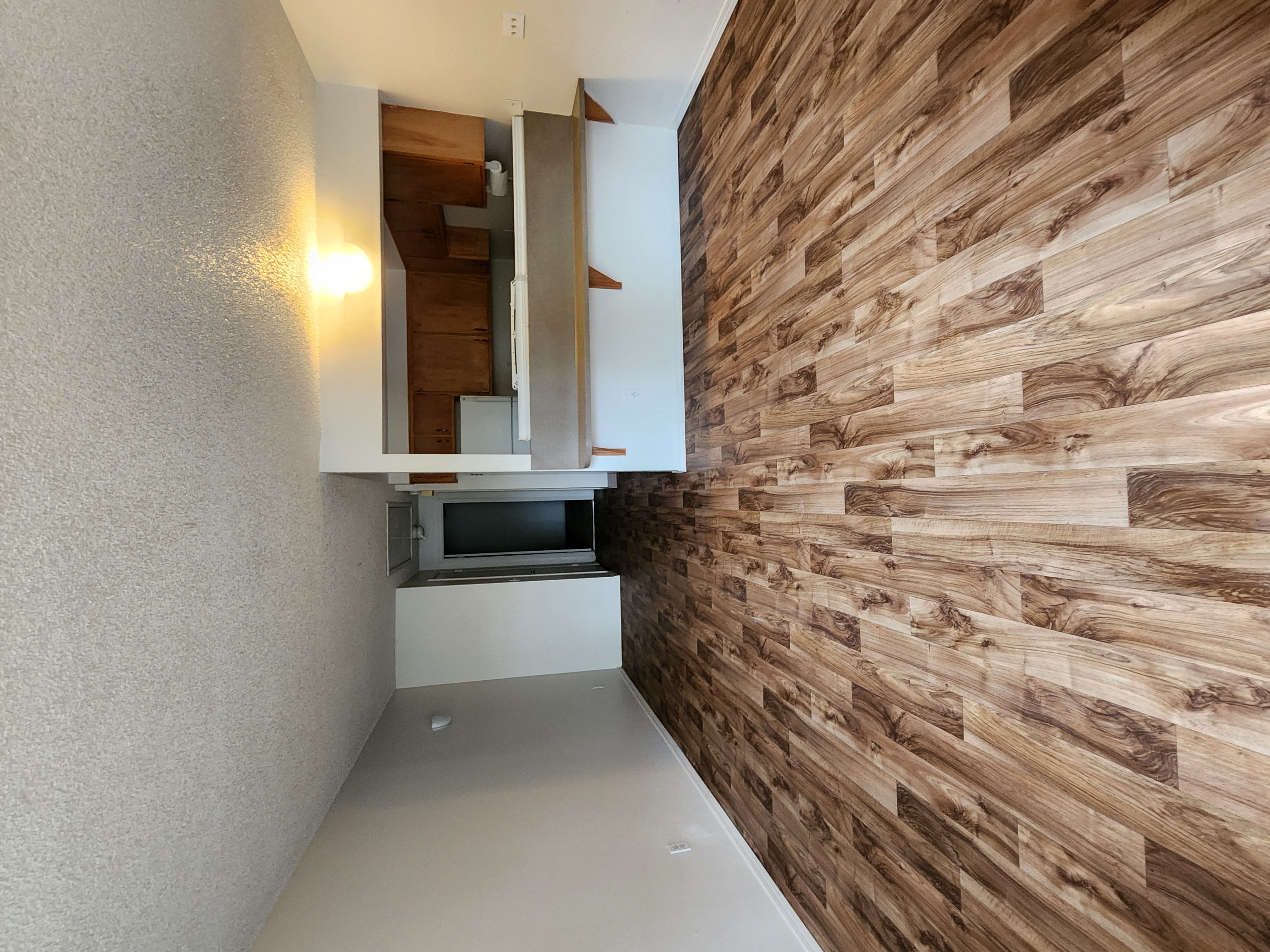 a small room with a small bed and a small window