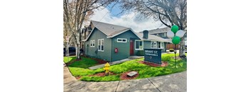 A house with a sign that says Bryant St. Townhomes.