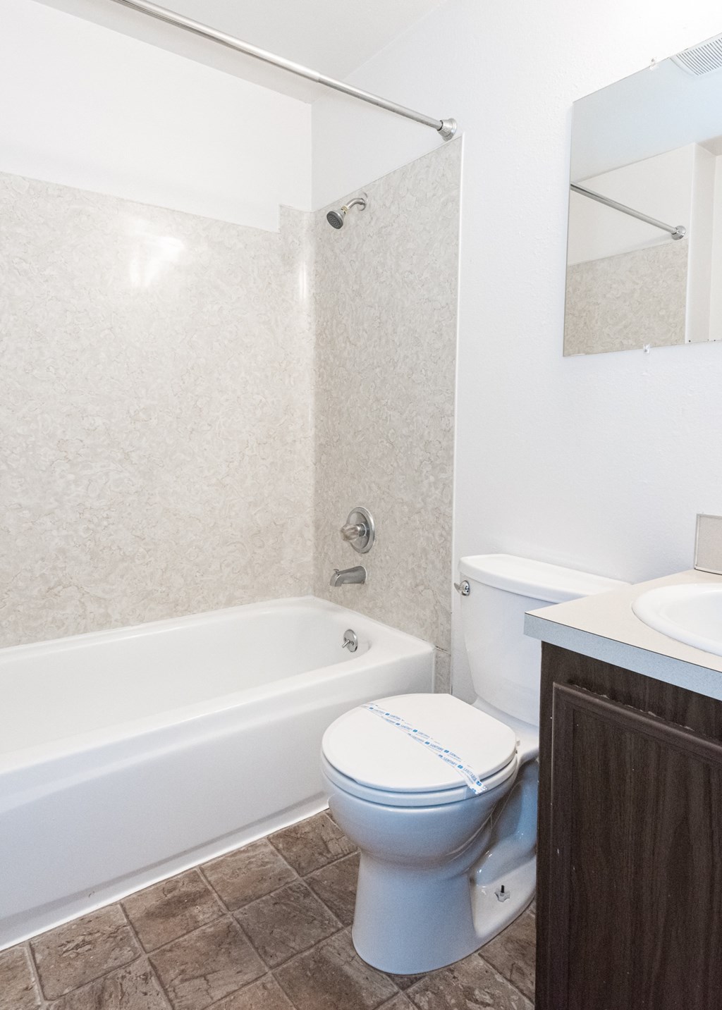 a bathroom with a toilet sink and bathtub