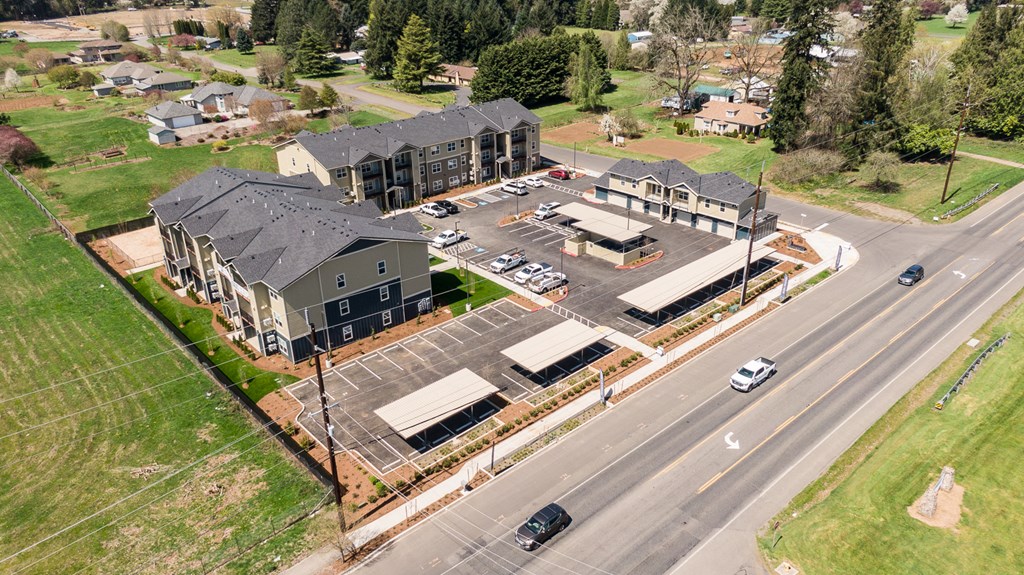 an aerial view of a building under construction next to a road