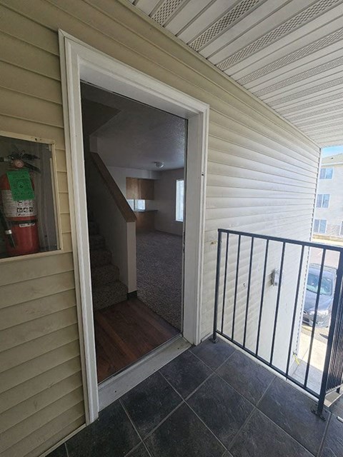 A view from the balcony of a house into the living room.
