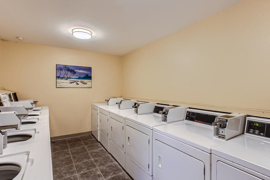 a washer and dryer room with laundry machines