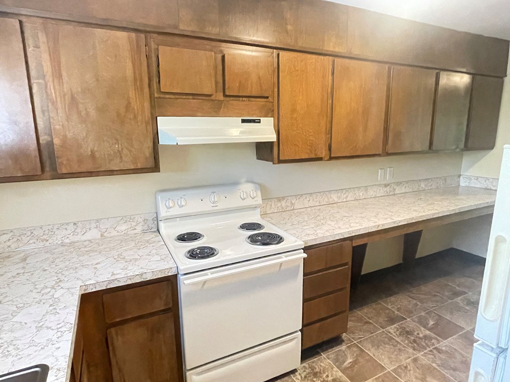 Metro Park Terrace kitchen with a stove and cabinets