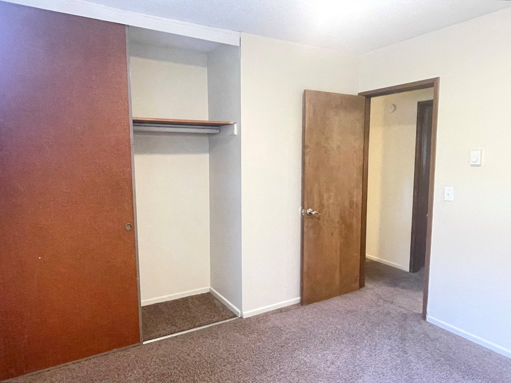 Metro Park Terrace  empty room with two doors and a shelf on the wall