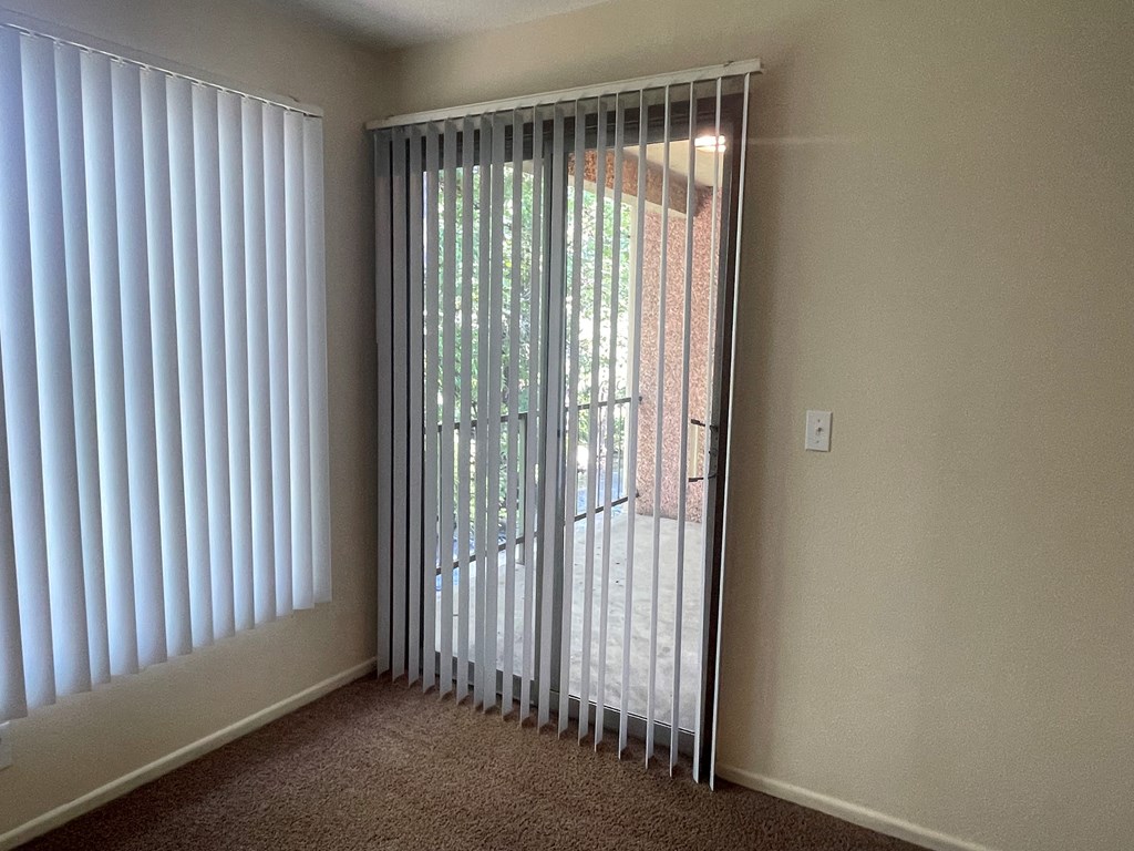 Metro Park Terrace  bedroom with a sliding glass door leading to a patio