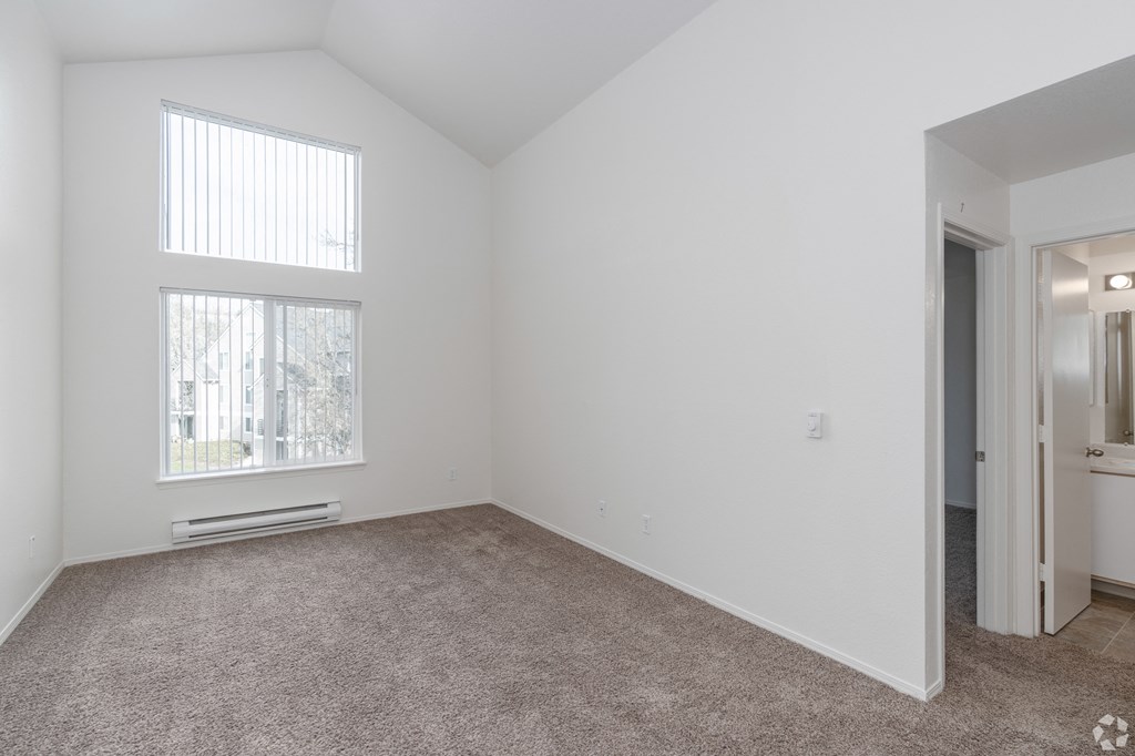 A room with a window and a door.