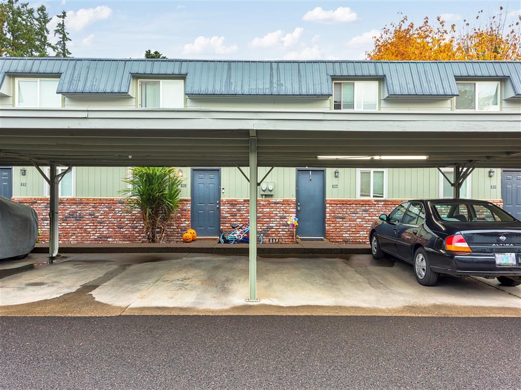 a car parked in a parking lot in front of a building