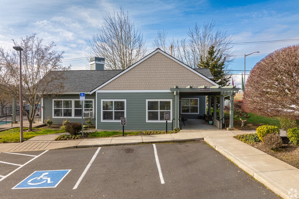 A parking lot with a disabled parking sign.