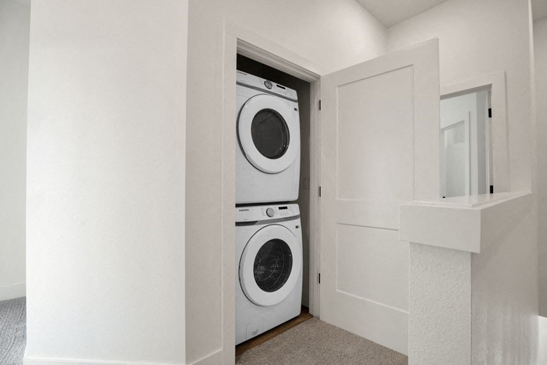 a washer and dryer in a closet in a home