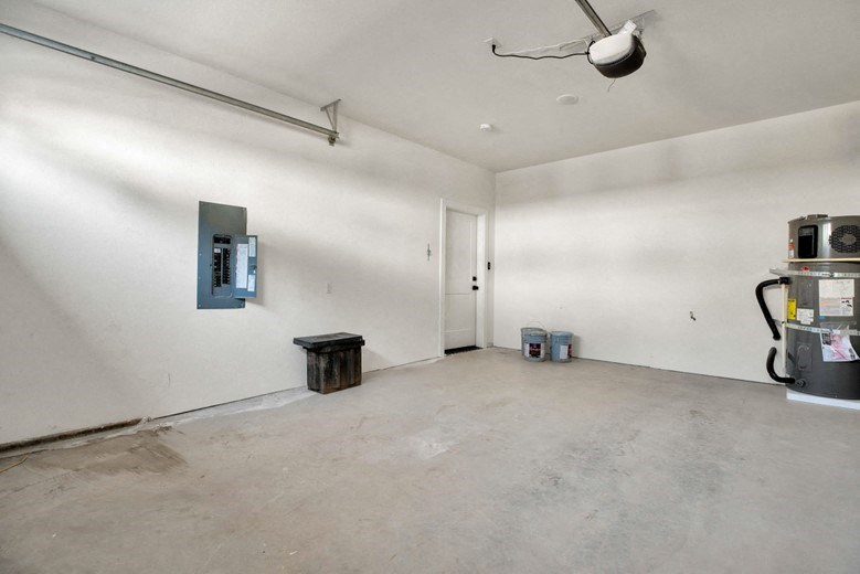 an empty room with a refrigerator and a stove in it