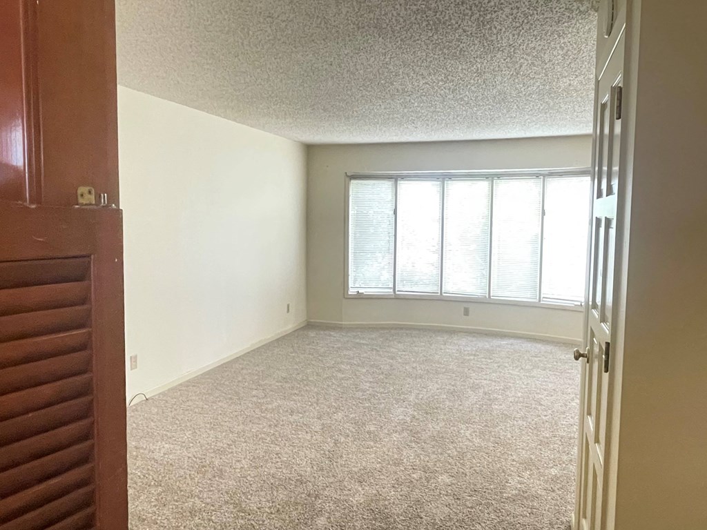 an empty room with a large window