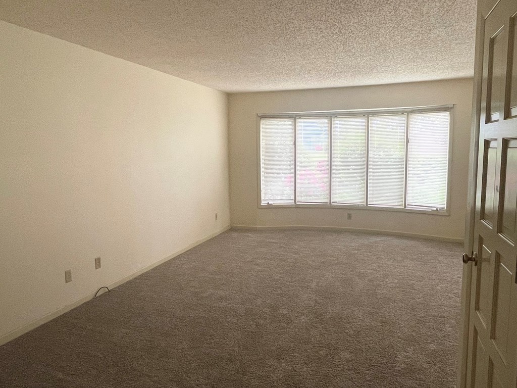 an empty room with a large window