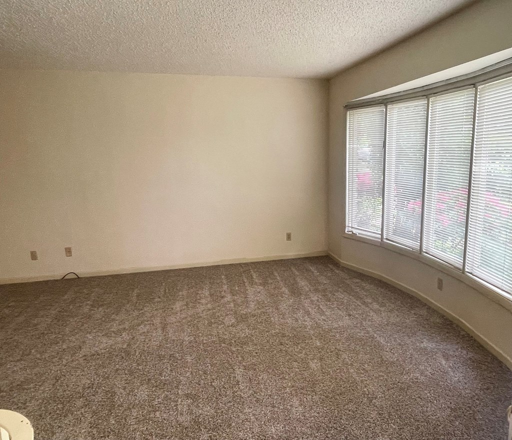 an empty room with a large window