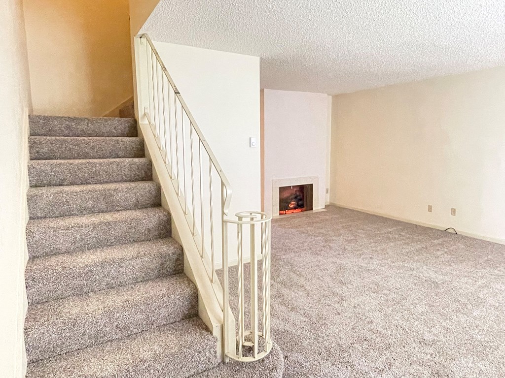 a view of the living room from the top of the stairs