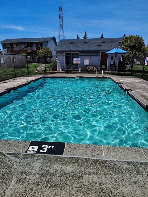 A pool with a 3 feet depth sign.