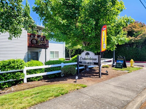 A sign for Orchardview is in front of a house.