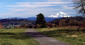 a dirt road with a mountain in the background Foothills Apartments Portland OR