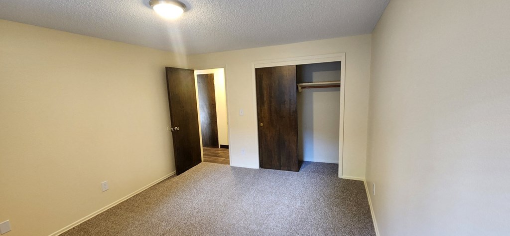 Nell Anna Court room with two doors and carpeted floor.