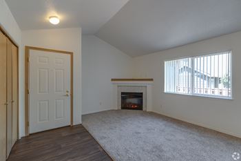 A room with a fireplace and a door.