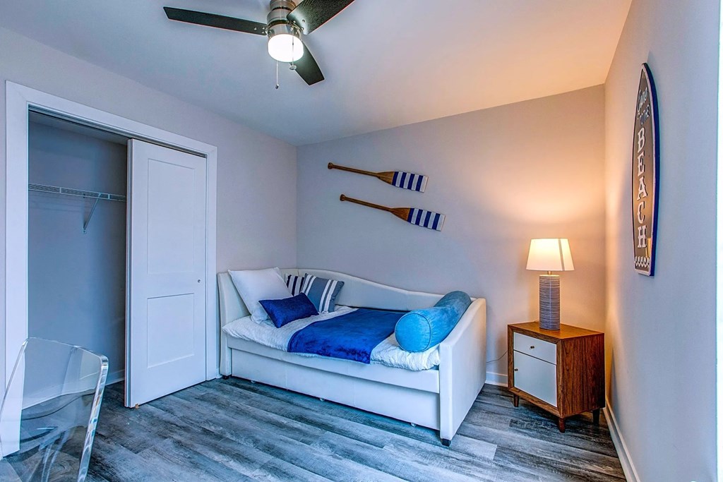 a living room with a couch and a door to a closet