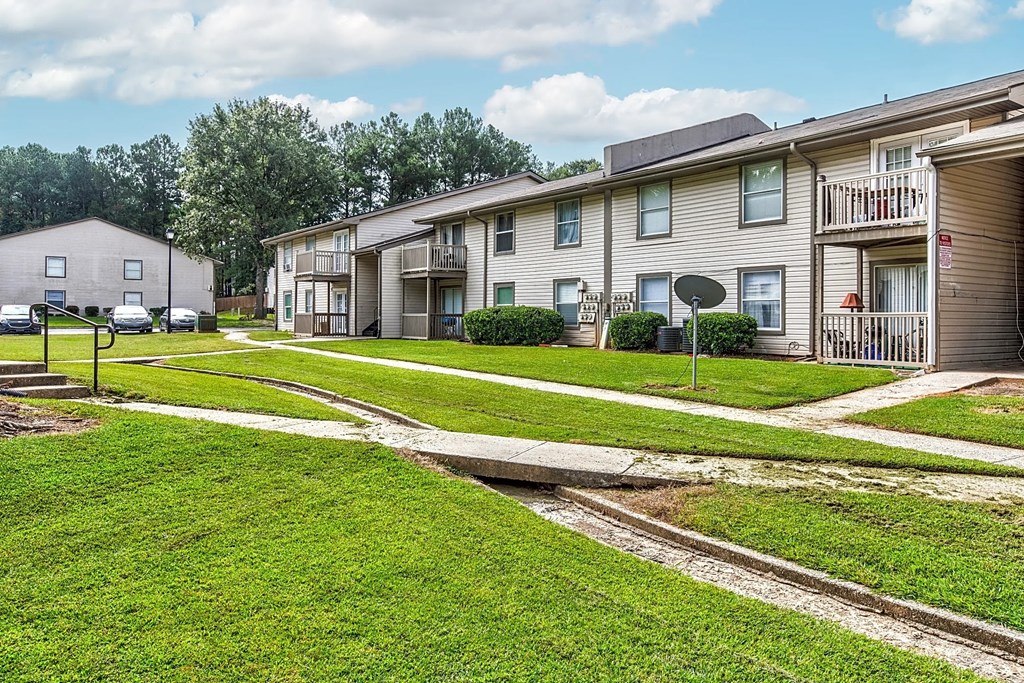 our apartments have a spacious courtyard with paths and grass