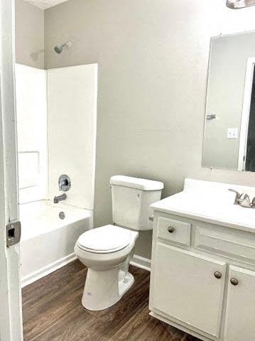 a bathroom with a toilet sink and bathtub