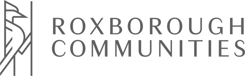 A green banner with the words "Roxborough Communities" written in white.