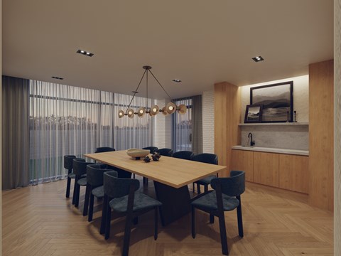 A modern dining room with a large table and chairs.