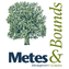 A logo with a tree and the words Metes and Bounds.