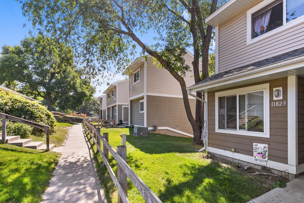 A residential area with houses and a clear sky.