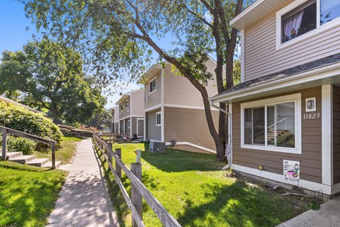 A residential area with houses and a clear sky.