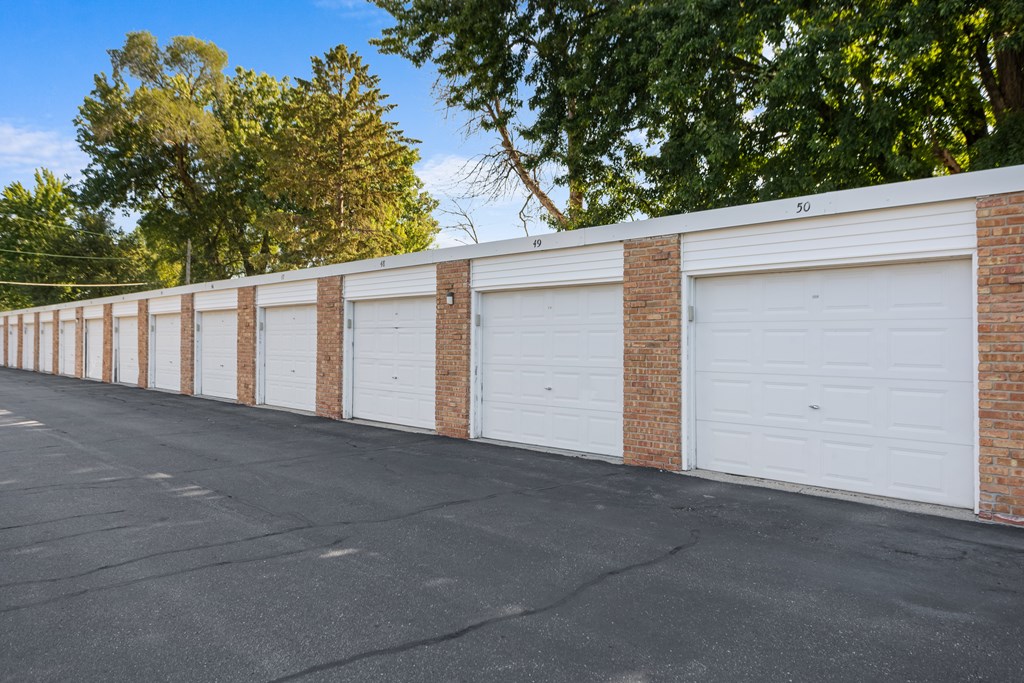 A long row of garage doors are closed.