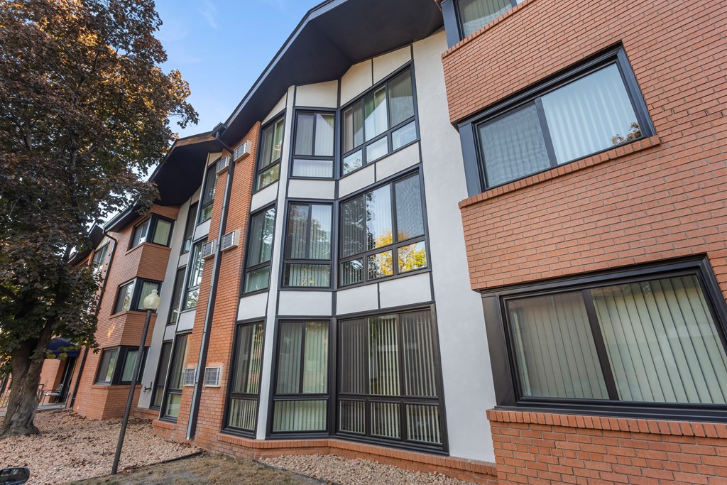 A modern building with a combination of brick and white walls.