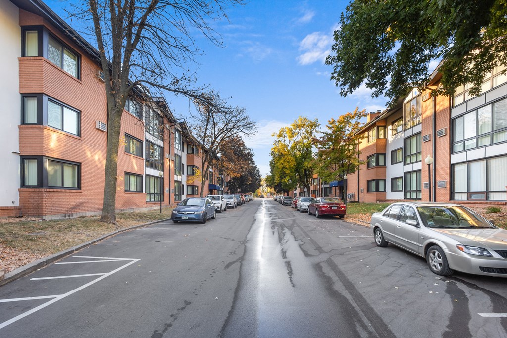 a city street with cars parked on the side of it