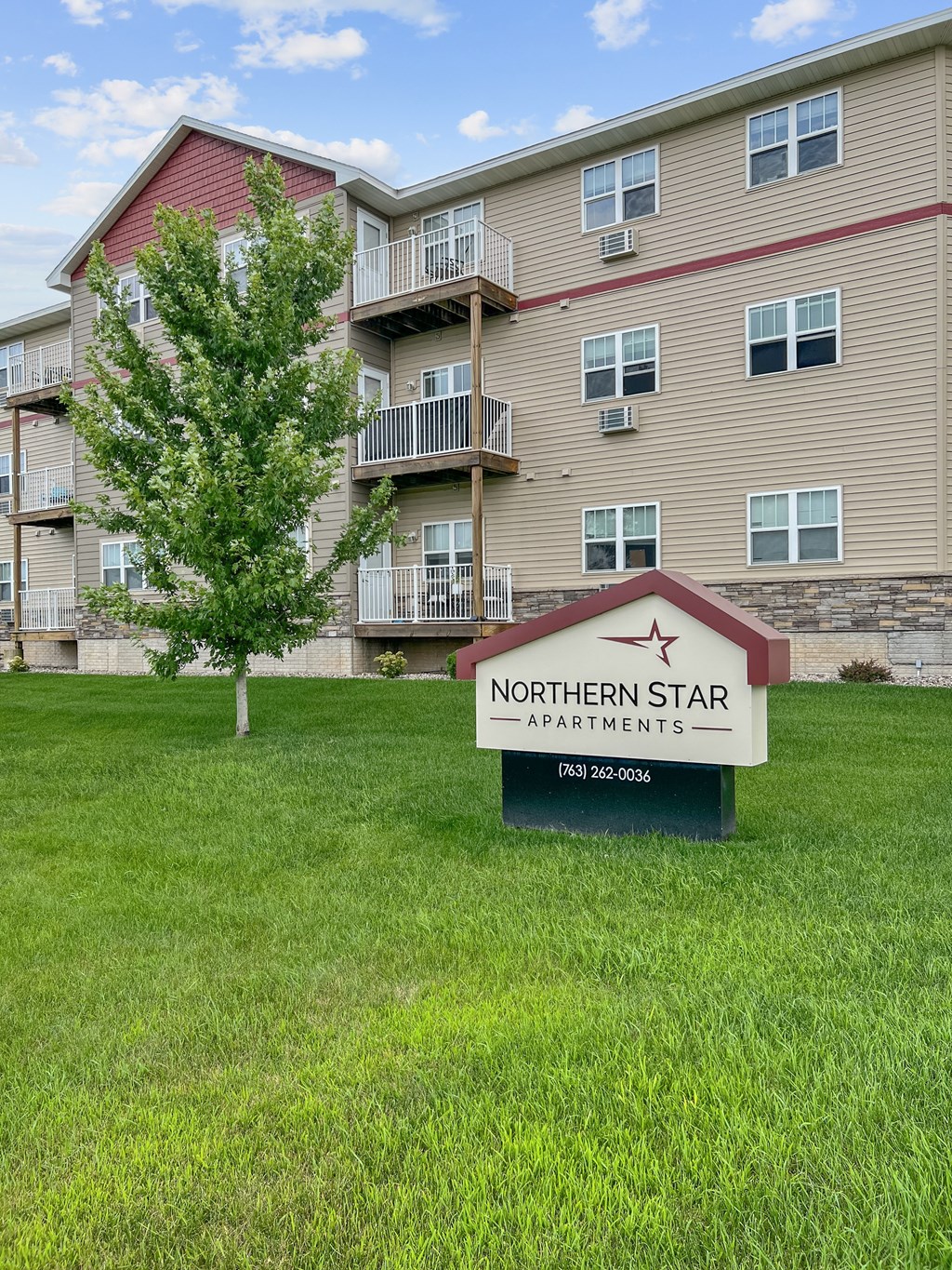 A building with a sign that says Northern Star Apartments in front of it.
