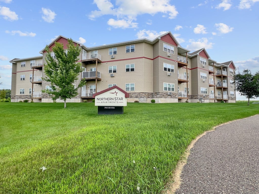 Apartment complex named Northern Star with a sign in front.