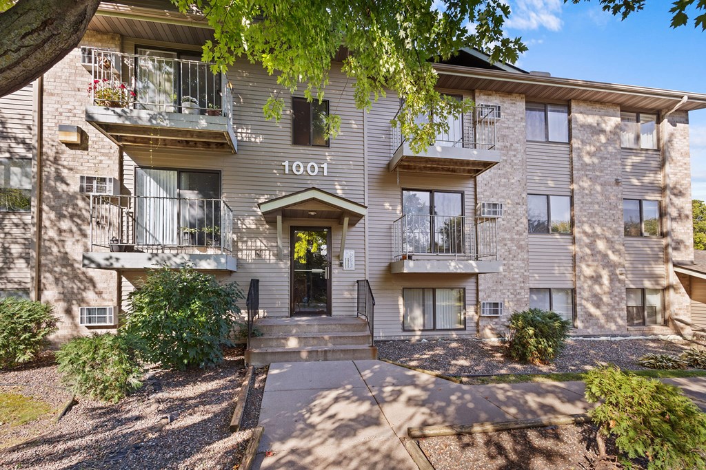 Apartment building with the number 1001 on the front door.