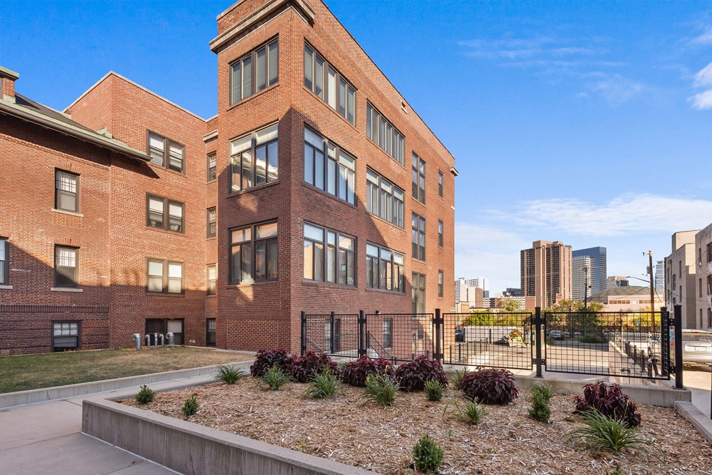 a large brick building with a view of the city
