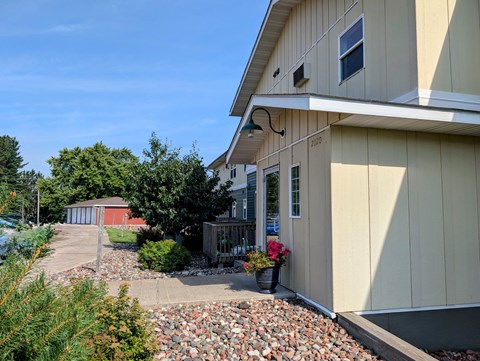 A house with a red shed in the background.