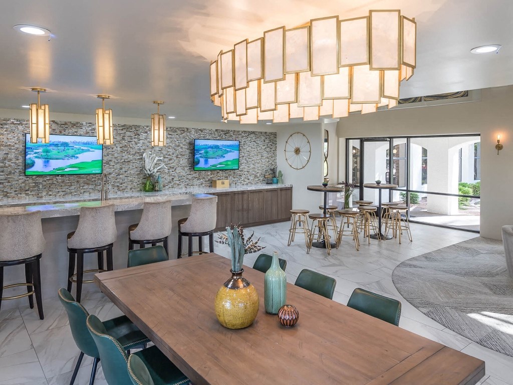 a dining room with a table and chairs