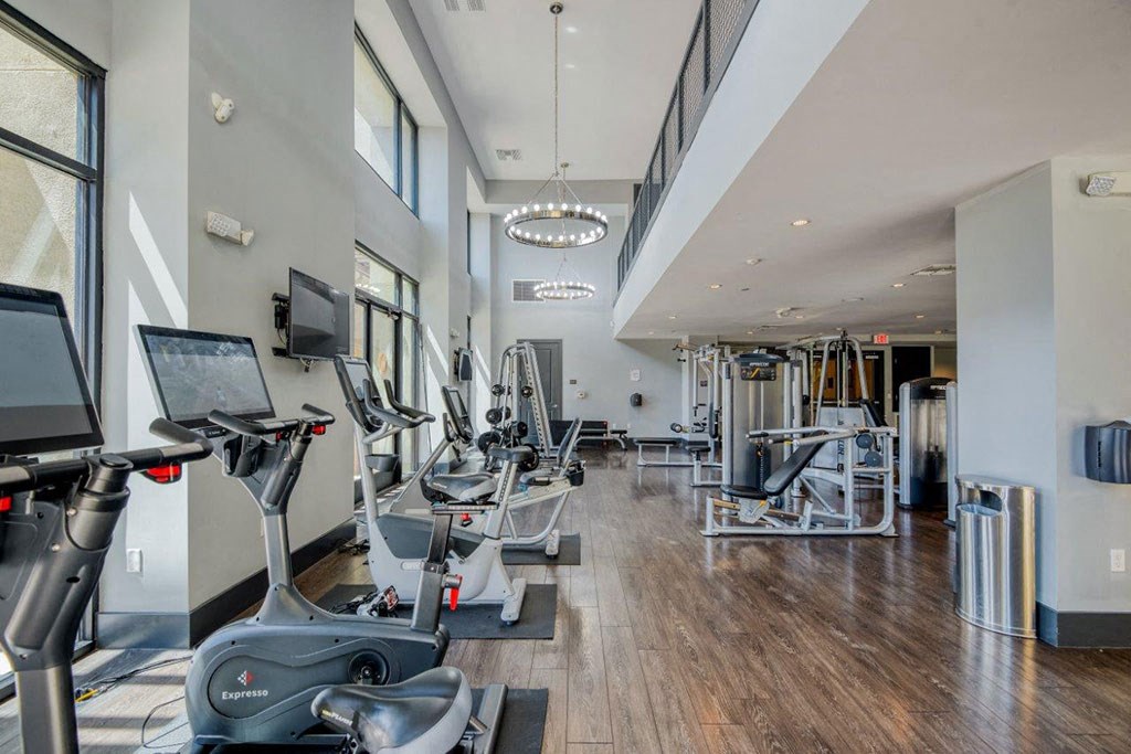 a gym with treadmills and other exercise equipment