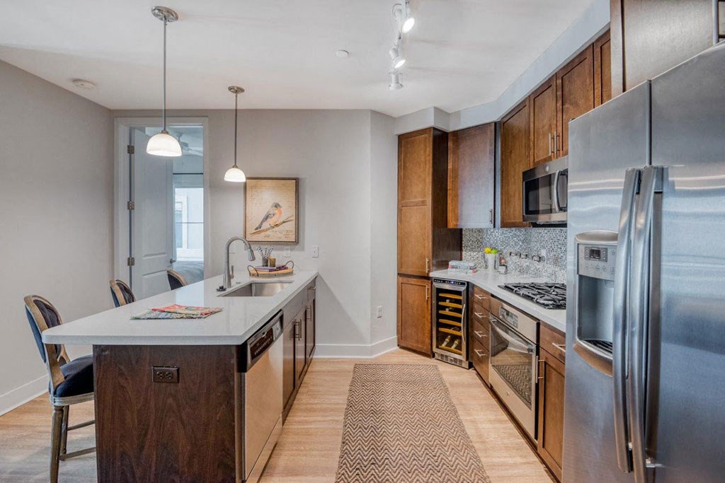 a kitchen with stainless steel appliances and wooden cabinets