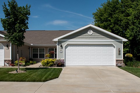 a house with a driveway and a white garage door