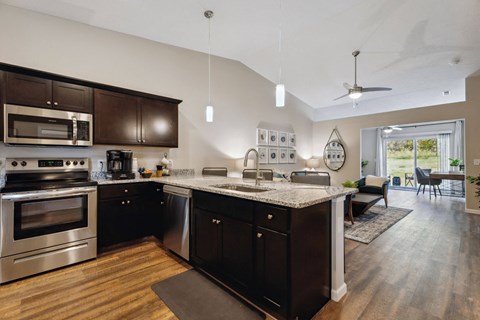 spacious kitchen with stainless steel appliances and granite counter tops