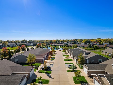 A suburban neighborhood with rows of houses and trees.