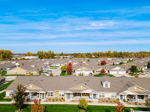 A suburban neighborhood with houses and trees.